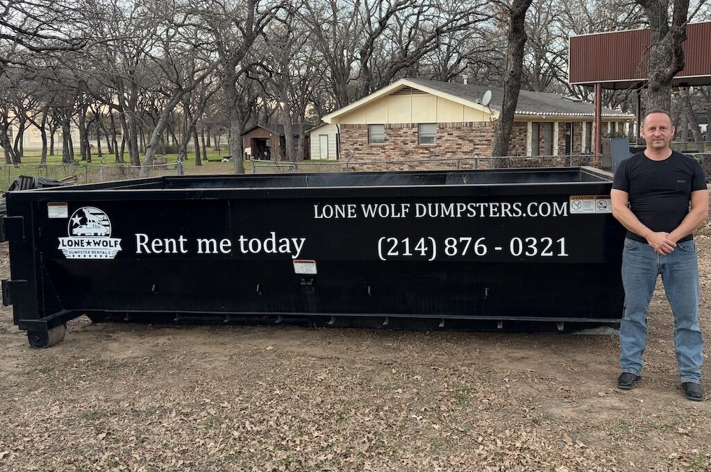 Lone Wolf 15-yard roll-off dumpster rental on residential driveway in Dallas-Fort Worth
