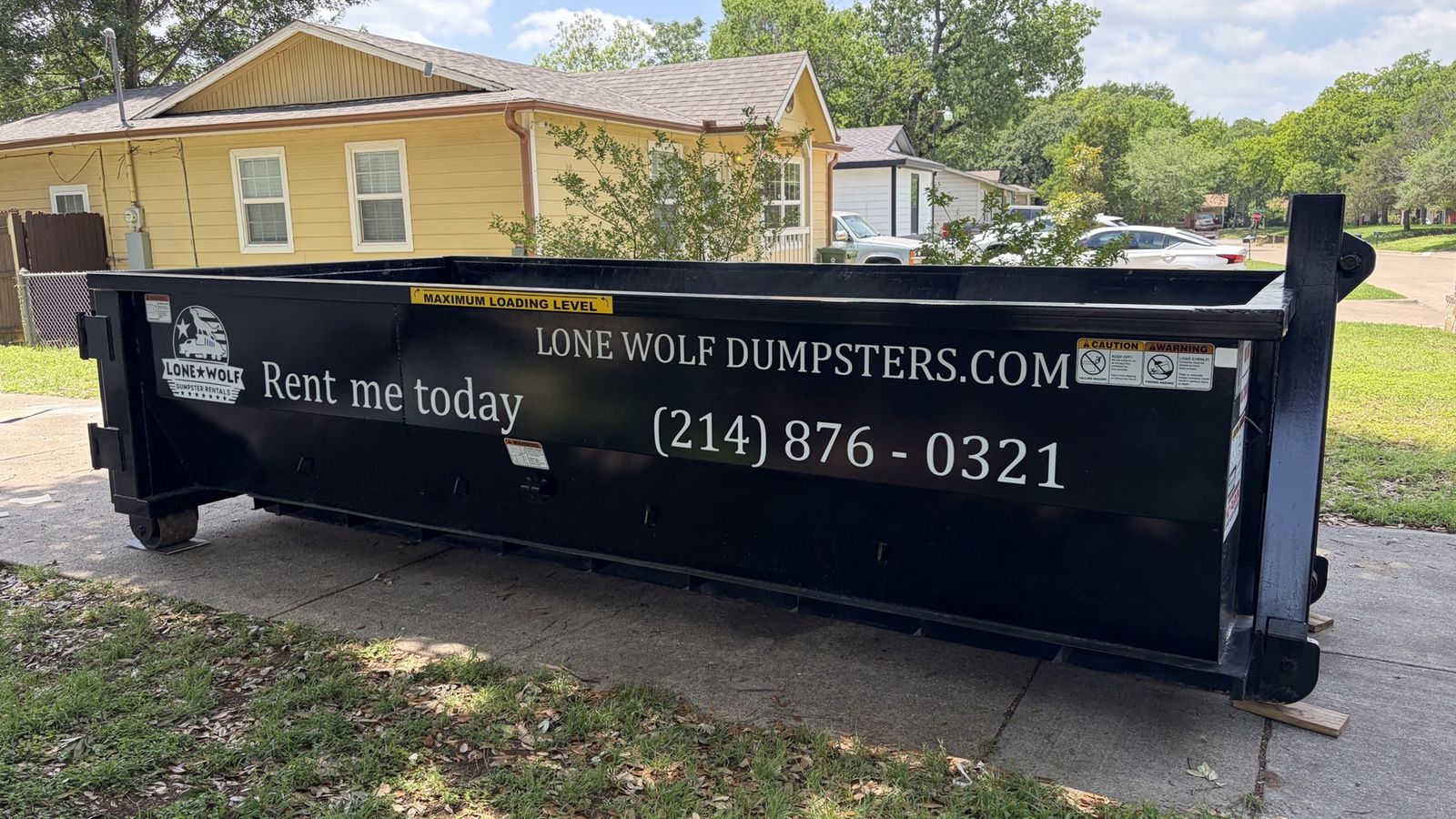 15 Yard Lone Wolf Dumpster in Residential Driveway Setting